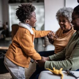 Boy with hearing loss interacts with family