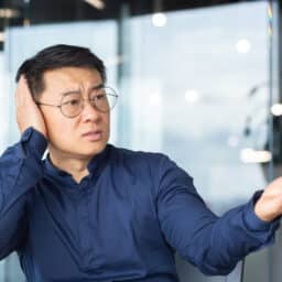 Man quiets someone in an office