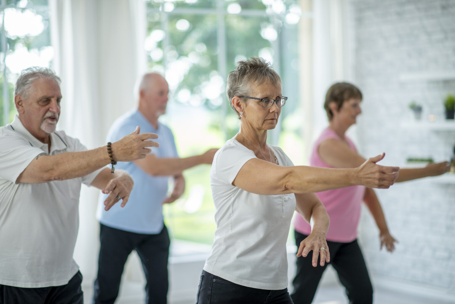 Tai Chi class; students practice balance and mindfulness.